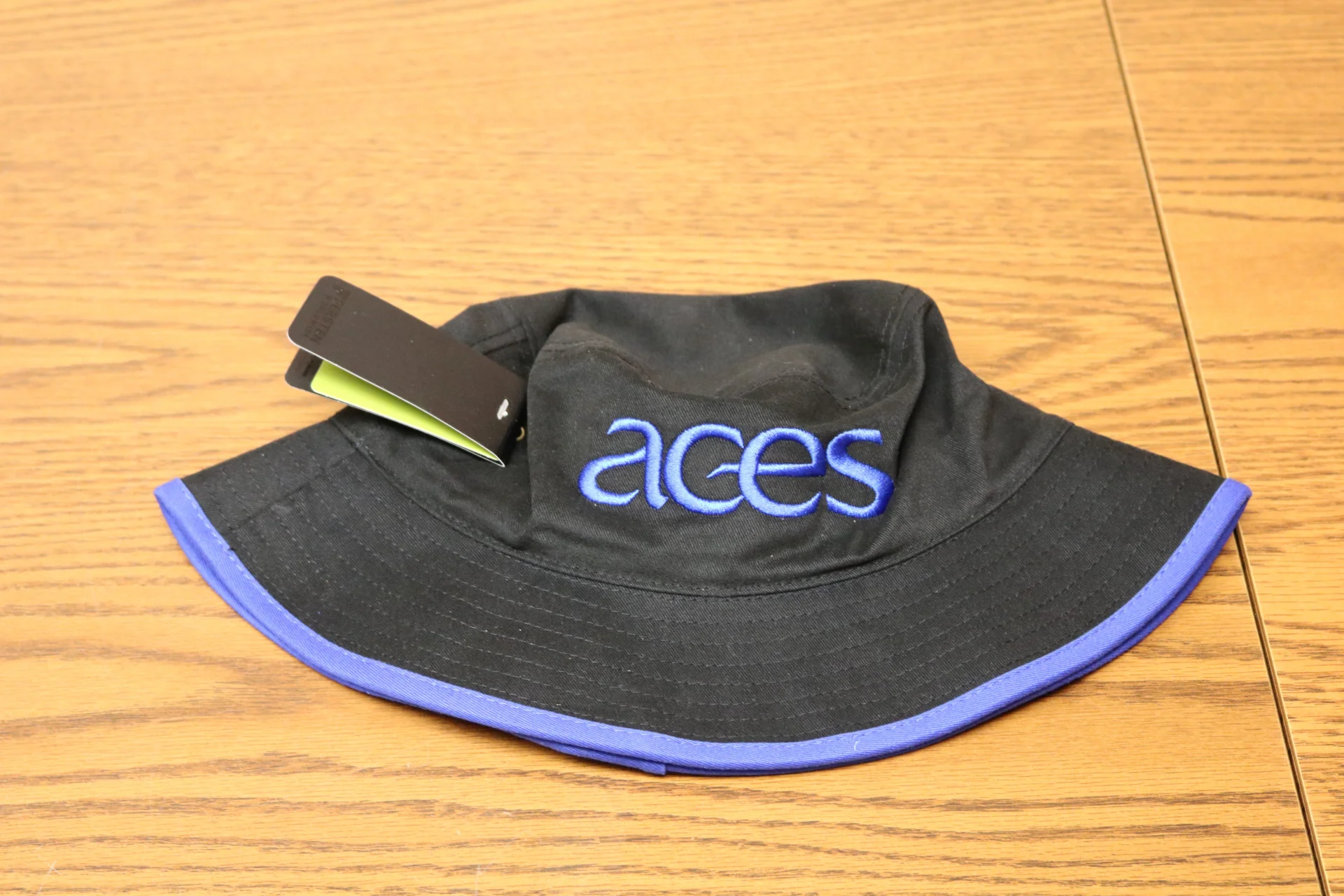 Black Bucket Hat with blue trim and ACES logo